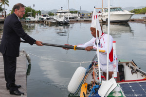 Governor of the British Virgin Islands, John Duncan, hands Victor one of his oars.