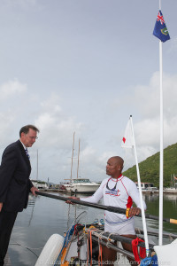 Governor of the British Virgin Islands, John Duncan, hands Victor one of his oars.