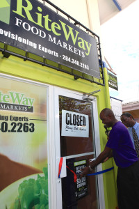 Devon "Best on De island" Rowe cuts the ribbon to the new RiteWay provisioning store